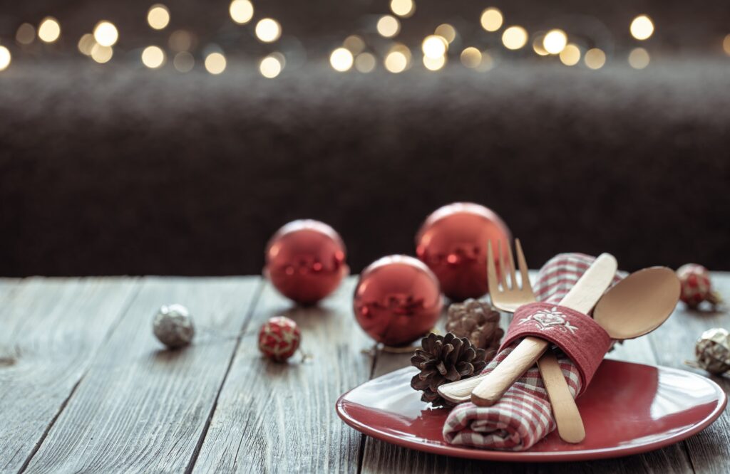 Christmas background with festive table setting copy space.